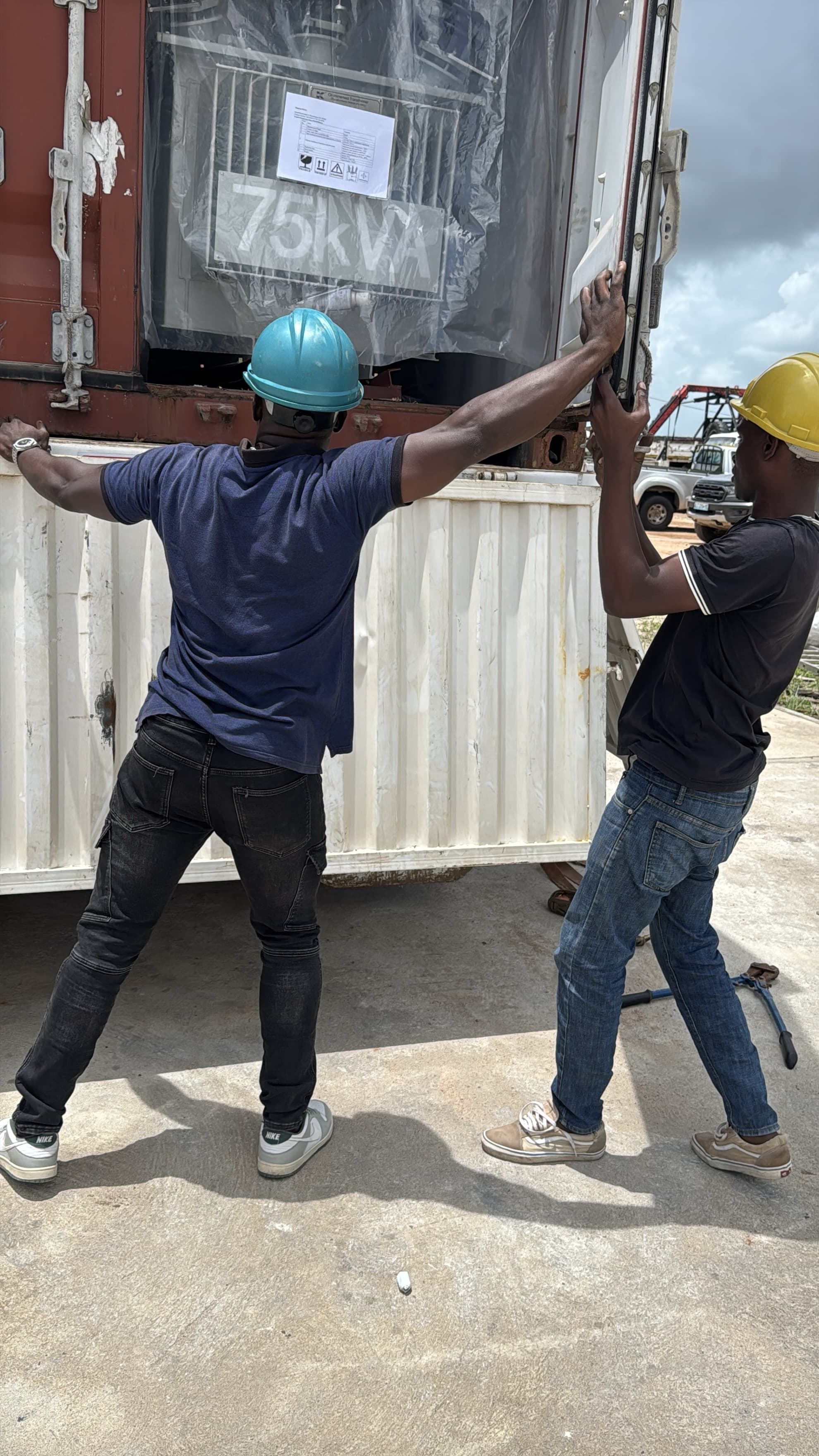 Workers unloading project cargo